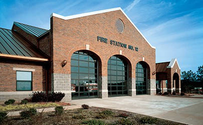 fire station with three glass overhead doors